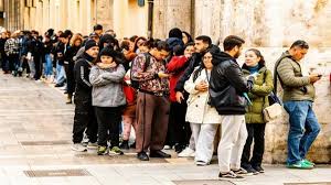 A program to legalise up to 500,000 migrants has begun in Spain