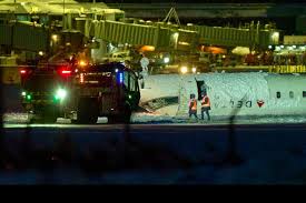In Toronto, the jet crashes and flips over, but all 80 people on board miraculously escape.