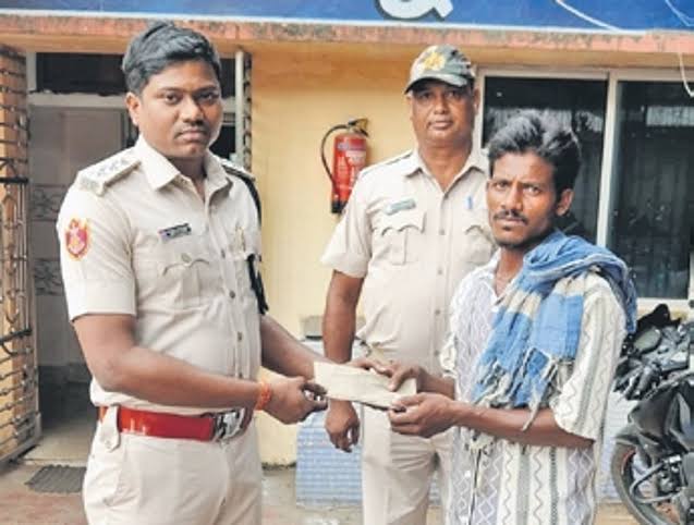 An old man is saved from drowning in the Mahanadi River near Cuttack by a young boatman who puts his own life at danger
