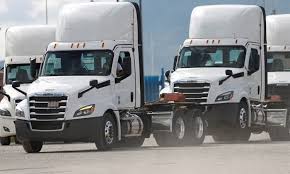 US tariffs on buses and big trucks go into force