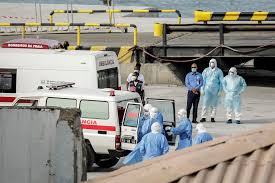 Health officials evacuate suspected Hantavirus patients from cruise ships while wearing hazmat suits