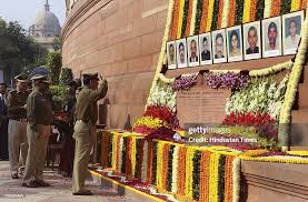 Security servicemen slain in the 2001 Parliament attack are honoured by PM Modi and lawmakers.