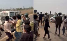 Villagers in Dhar, Madhya Pradesh, protest a quarry survey by throwing stones into it.